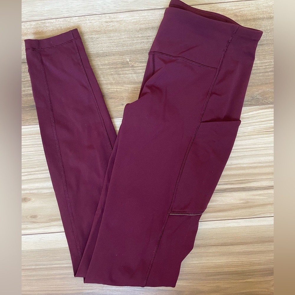 Fast and free lululemon leggings in maroon with reflective strips